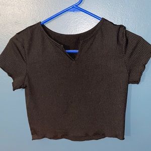 black crop top with slit at neck